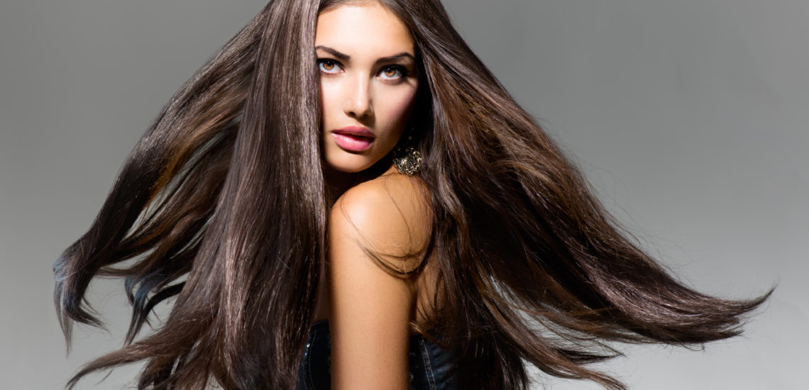 Fashion Model Girl Portrait with Long Blowing Hair
